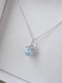 Srebrny naszyjnik ośmiornica z błękitną perłą Swarovski w pudełku ISSI.png